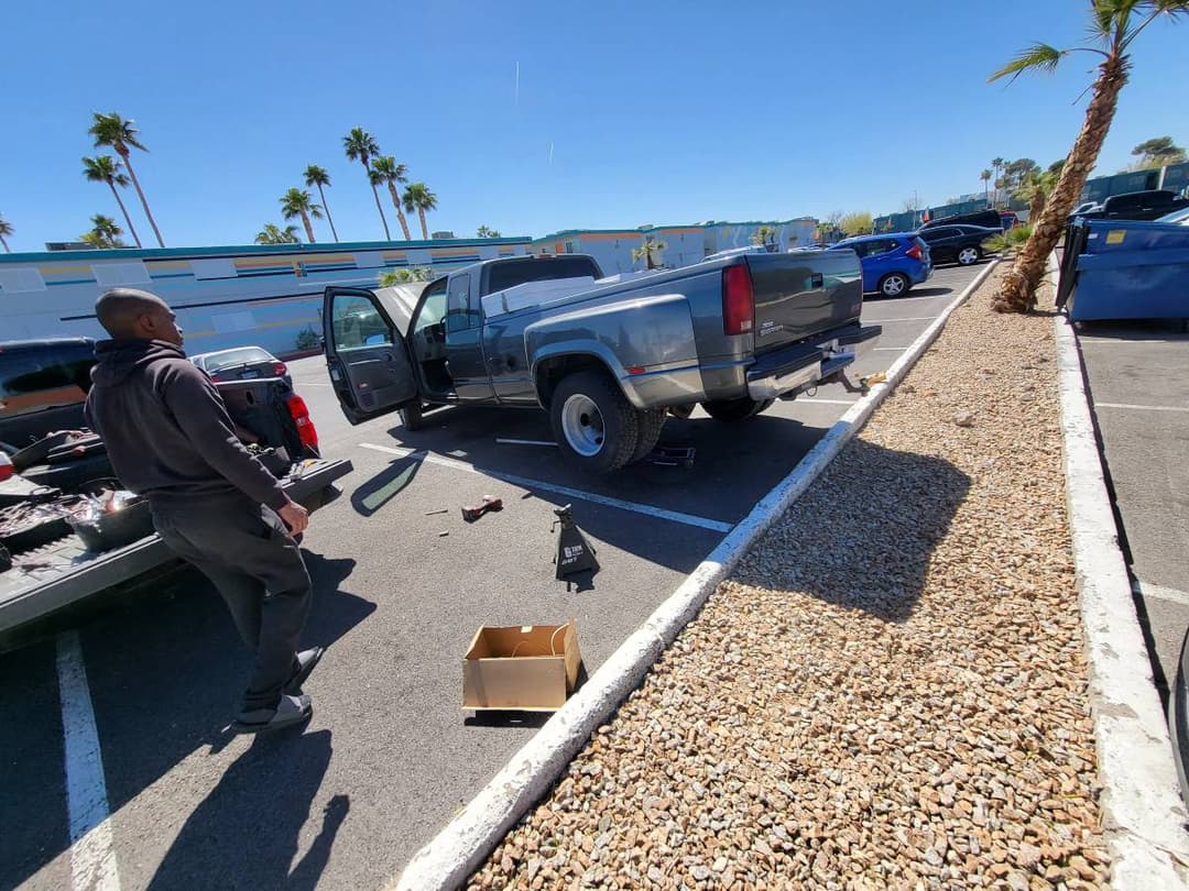 picture of a mobile mechanic replacing the rear wheels of a truck