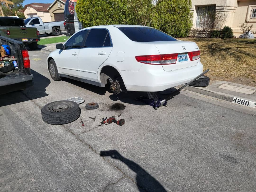 picture of a car that is getting its brakes replaced